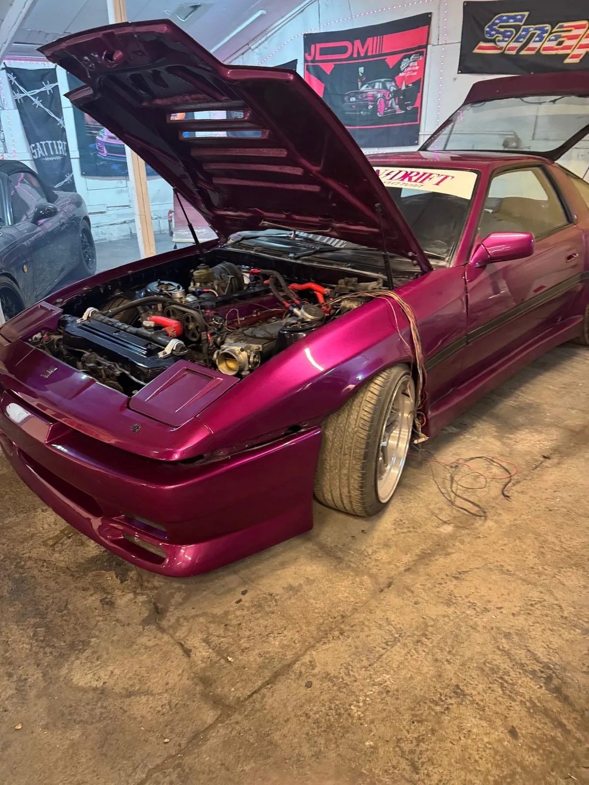 Toyota Supra MK3 in the workshop with engine bay open