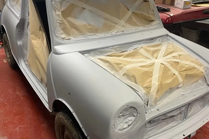 Classic Mini being prepared for paint inside the Custom Body Repair workshop